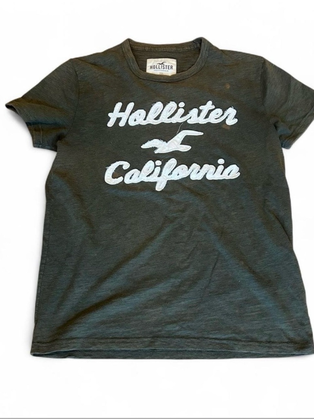 Hollister White Script Logo Tee on Dark Green